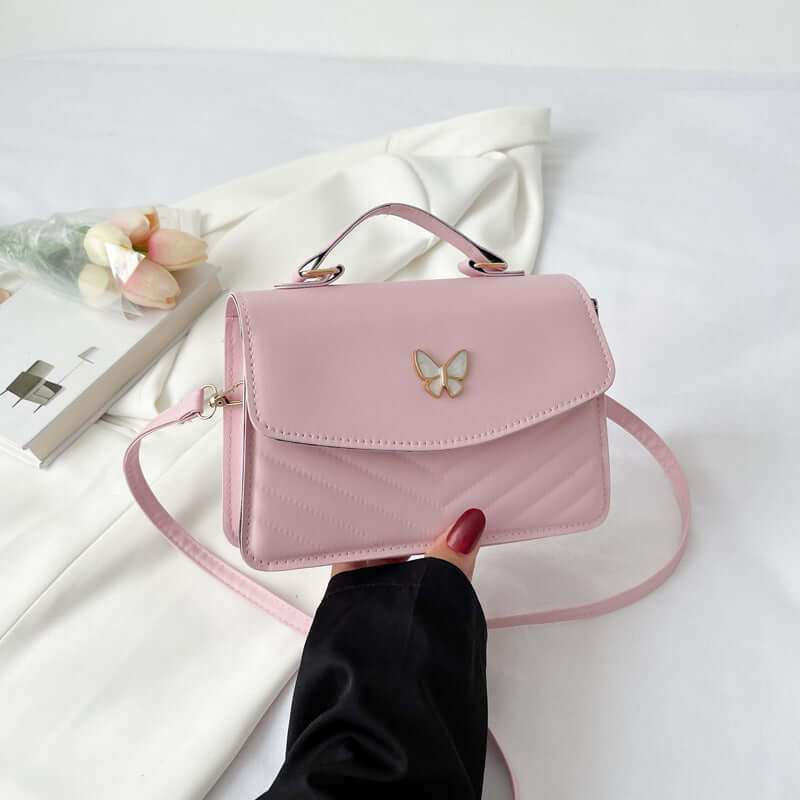Dropshipman Simple Crossbody Bag small pink leather handbag with top handle long strap and butterfly detail