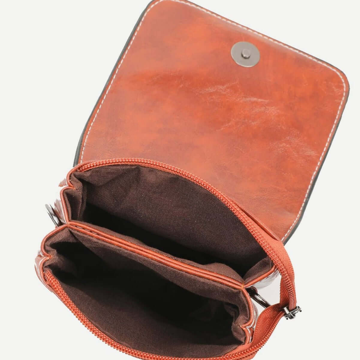 Interior view of the Fashion Simple Large Capacity Mobile Phone Bag Mini Crossbody Bag in brown, revealing its well-organized compartments and soft lining. A must-have fashionable mini bag.