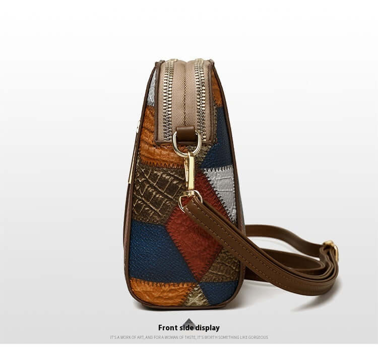 Side view of a soft leather shoulder bag with patchwork design and brown adjustable strap