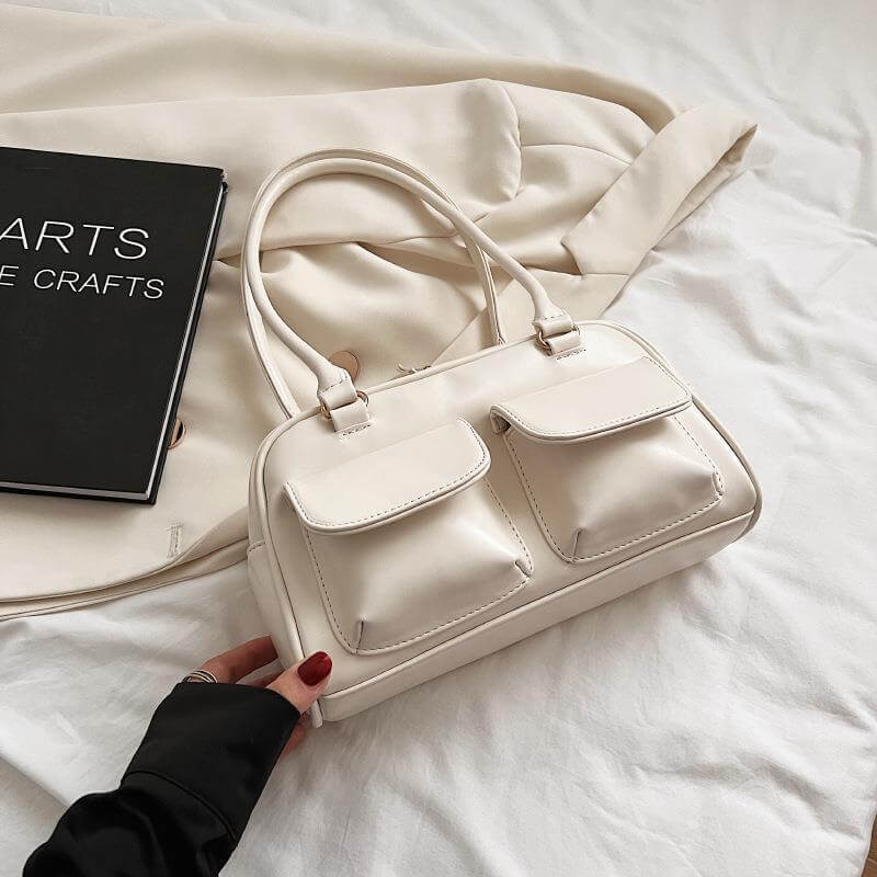 Stylish work handbag for women in cream color with double front pockets and shoulder straps