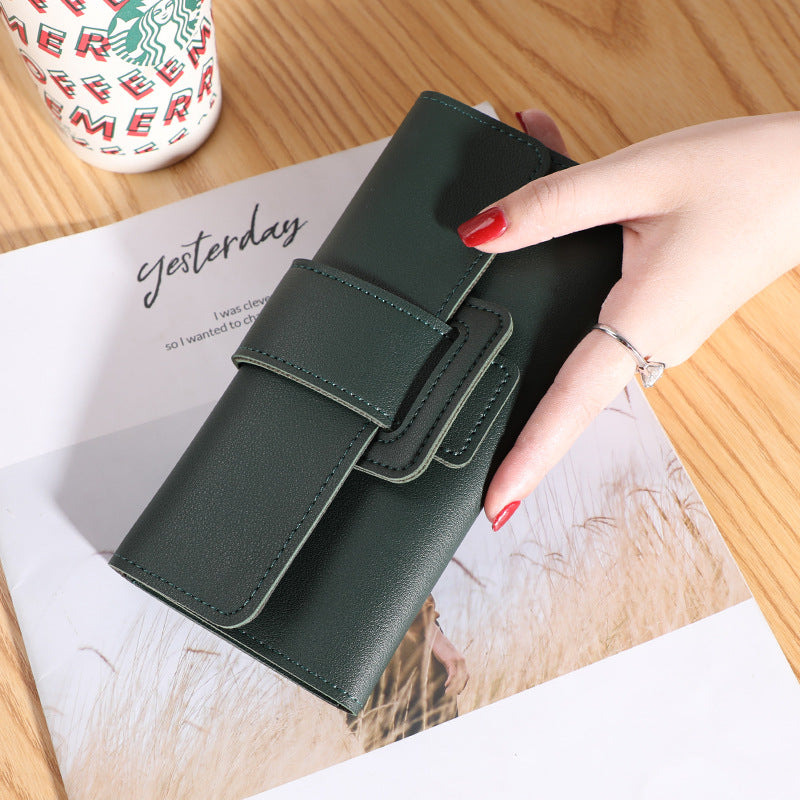 Women's Long Wallet Tri-fold Clutch in rich dark purple, offering a blend of elegance and generous space.