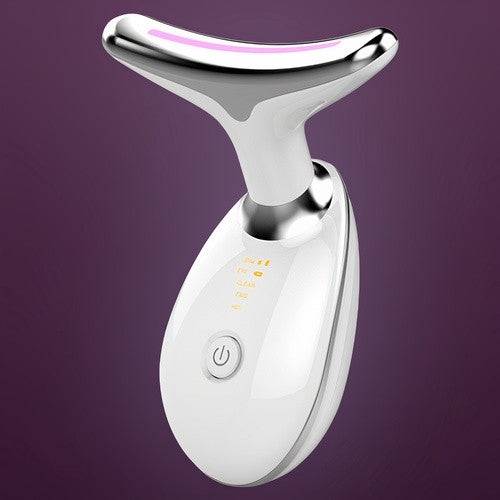 The Pure Aura Micro Glow Massager displayed on a purple background, showcasing its sleek design and features for revitalizing skin. This beauty tool is part of the lumiglow, lumiglow pro collection.