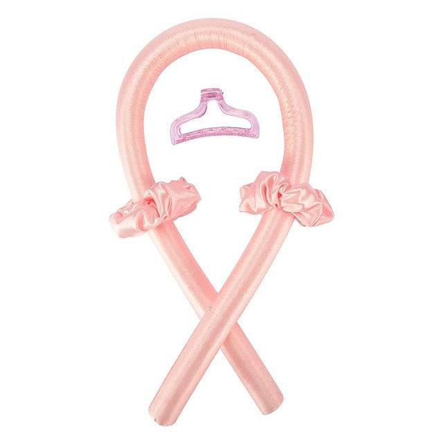 Vibrant pink Heatless Curling Rod Headband displayed with a matching clip, perfect for creating beautiful curls without damaging hair. A must-have in the beauty routine for effortless styling. Tags: beauty, curler, hair styler.