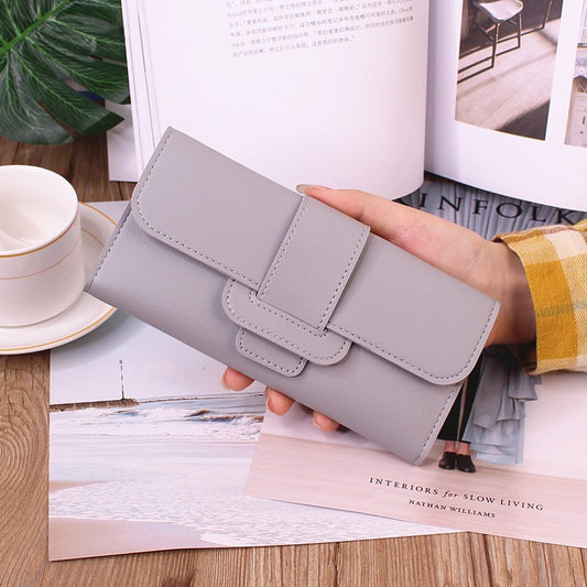 Women's Long Wallet Tri-fold Clutch in soft light gray color, featuring a spacious interior for efficient organization.