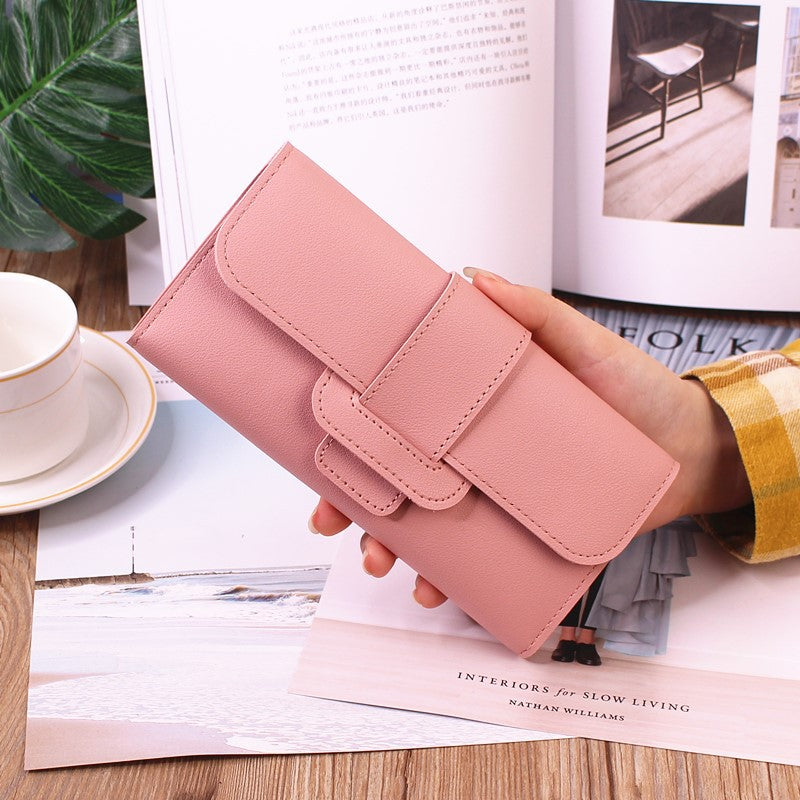 Women's Long Wallet Tri-fold Clutch in delicate light pink, designed for elegance and ample storage.