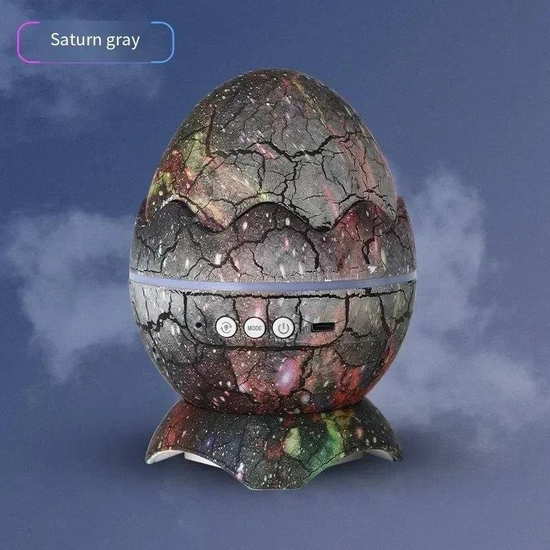 Dinosaur Egg Galaxy Projector in Saturn Gray design, displayed against a subtle cloudy background, emphasizing its modern aesthetic.