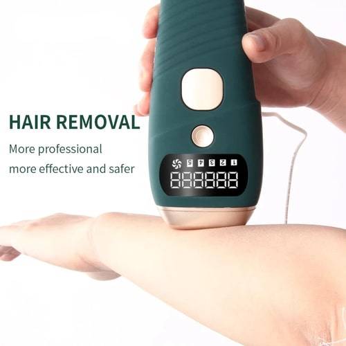 At-home laser hair removal device being used on an arm. Painless and effective for permanent hair reduction, safe for all skin types.