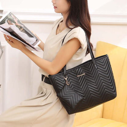 Trendy Women's Shoulder Bag with Wave Pattern Diamond Plaid Embroidery in black, displayed as a fashionable shoulder bag while being used by a model, sitting comfortably.