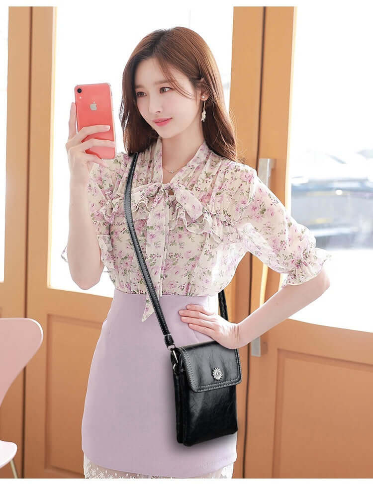 Fashion Simple Large Capacity Mobile Phone Bag Mini Crossbody Bag in use, modeled by a woman in a floral outfit, demonstrating its versatility as a fashionable mini bag.