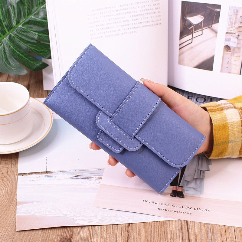 Women's Long Wallet Tri-fold Clutch in soothing light blue, perfect for carrying essentials in style.