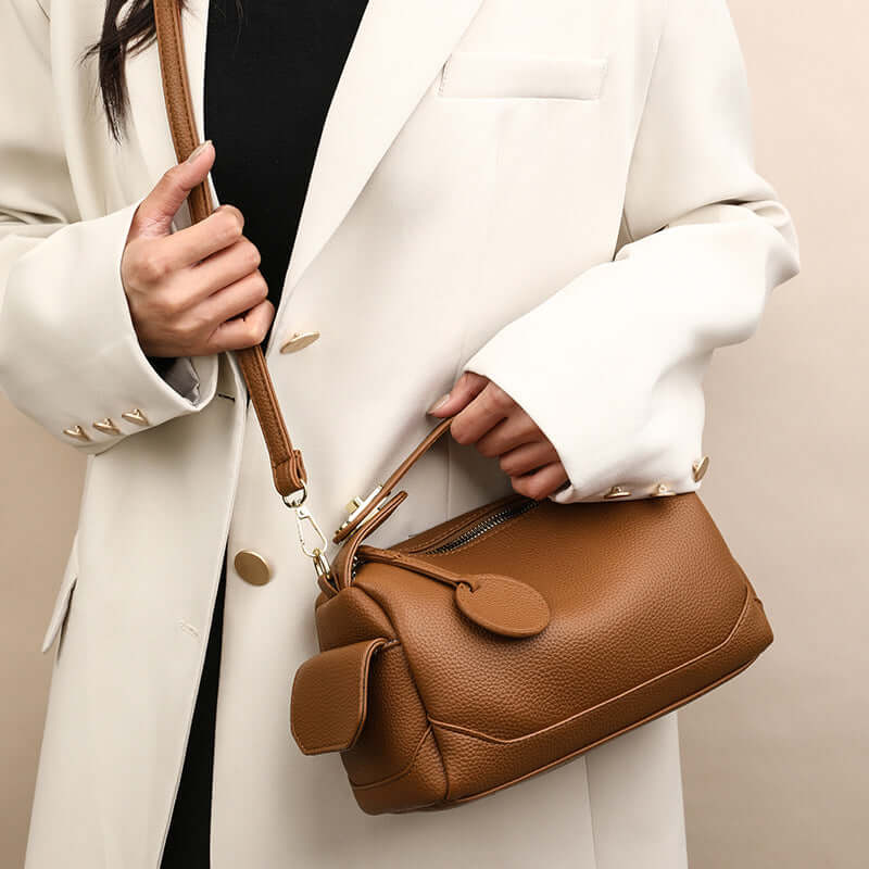 Crossbody Soft Leather Large Capacity Pillow Bag - A close-up view of a brown handbag for women, emphasizing its detail and spacious design.