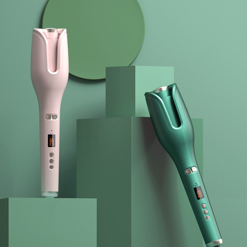 Big Wave Perm Anion Curling Iron in pink and green colors, displayed as an essential hair curling tool on stylish geometric backgrounds.