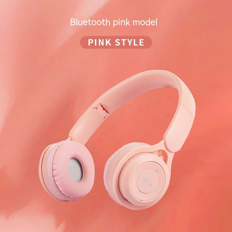 Pink model of foldable Bluetooth Headset showcasing comfortable design for extended wear.