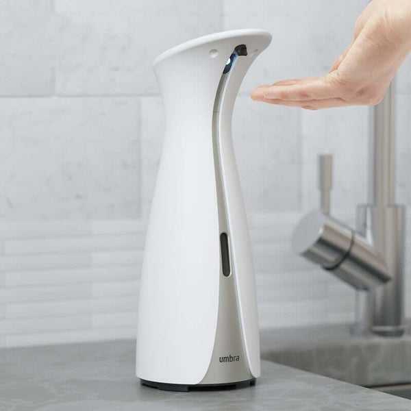 Modern Soap Dispenser - European Style Automatic Induction Hand Sanitizer Bottle in Black & White, showcasing touch-free operation with a hand under the dispenser.
