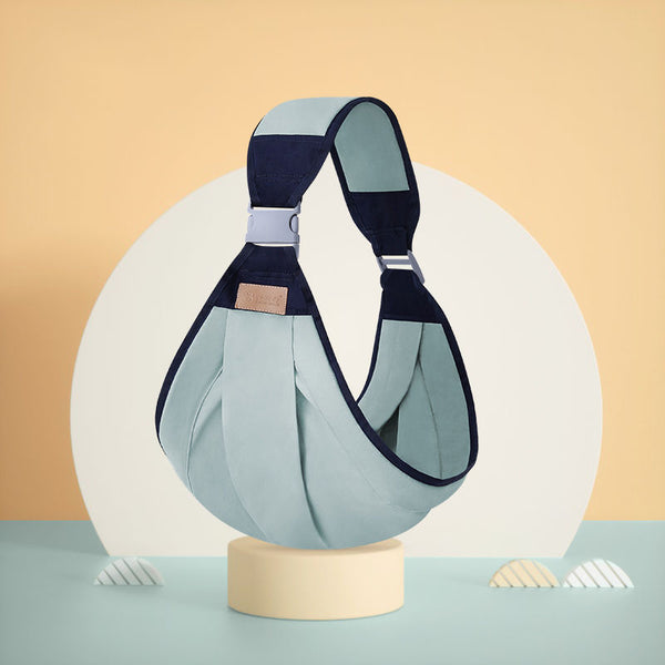 Horizontal Front Carrying Baby Carrier displayed on a pedestal, emphasizing its sleek design and fabric.