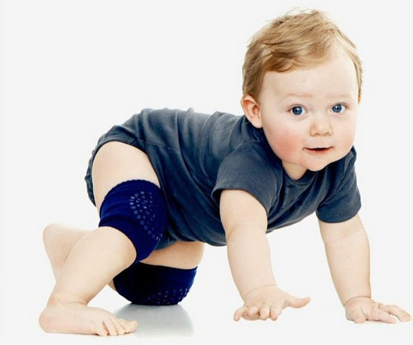 A toddler crawling while wearing non-slip blue toddler knee pads, part of the Children's Glue Dispensing Non-slip Knee And Elbow Pad Crawling Toddler Knee Pads collection.