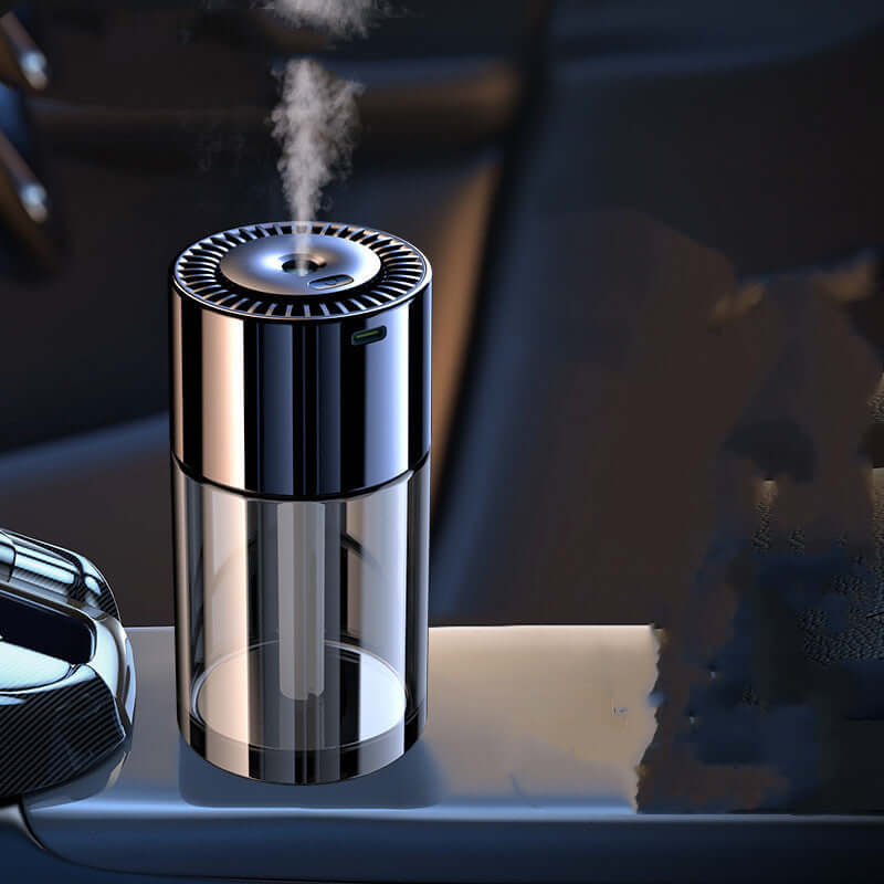 AI powered fragrance dispenser releasing mist with sleek black and transparent design on a surface
