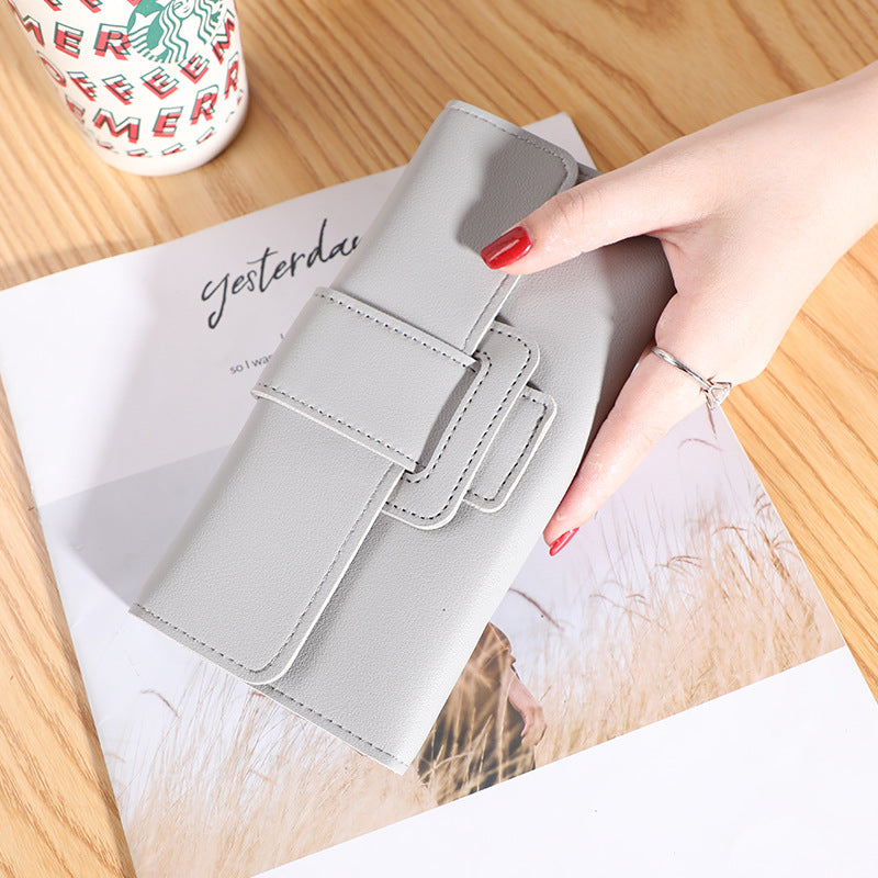 Women's Long Wallet Tri-fold Clutch in charming dark pink, providing a mix of fashion and practicality.