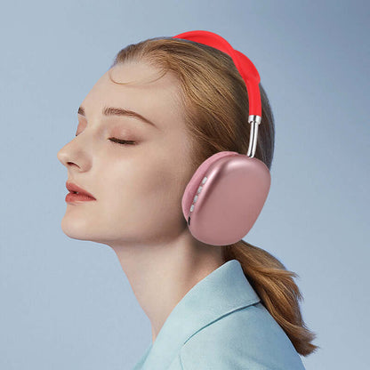 Bluetooth headset for gaming and sports in rose gold with red headband worn by woman