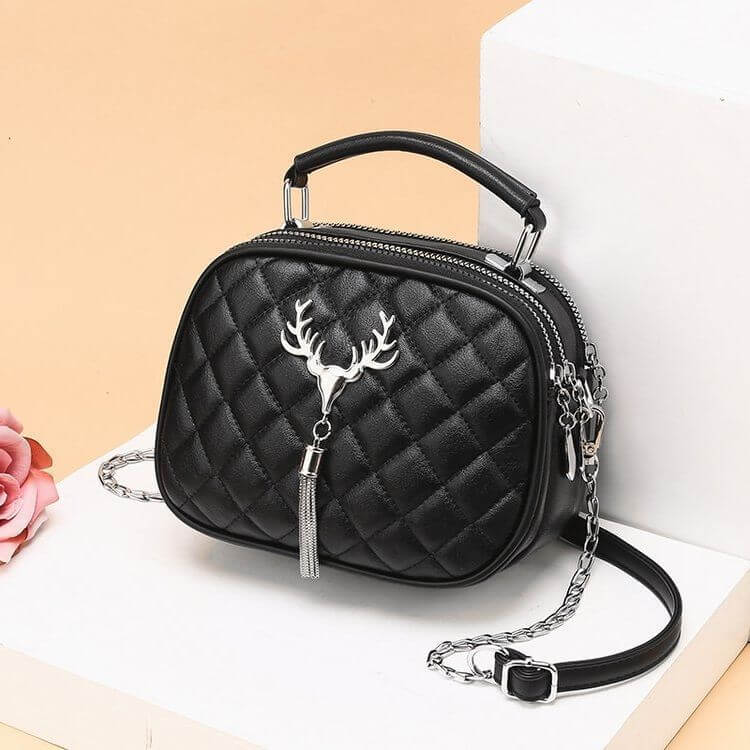 Black quilted one shoulder handbags for women with silver deer charm and chain strap