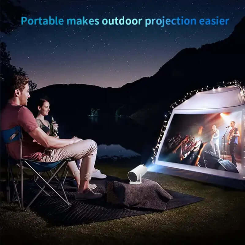 Couple watching outdoor concert projected on tent using portable android smart projector at night