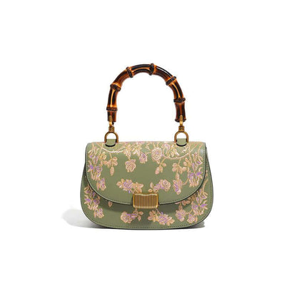 Stylish Cowhide Leather Handbag with Exquisite Embroidery and Bamboo Handles for Women - Front view of an olive green cowhide leather handbag with beautiful embroidery and a bamboo handle.