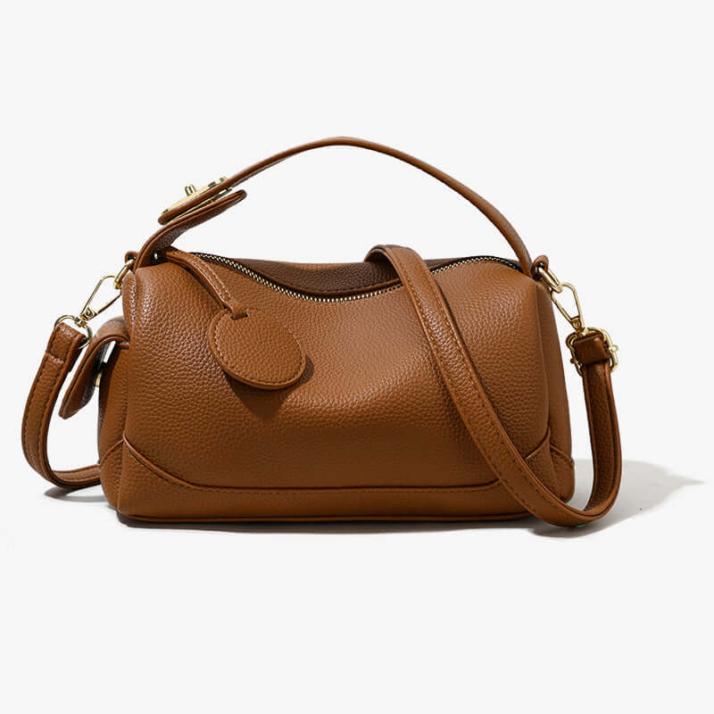 Crossbody Soft Leather Large Capacity Pillow Bag - A brown fashionable handbag for women elegantly displayed against a minimalistic backdrop.