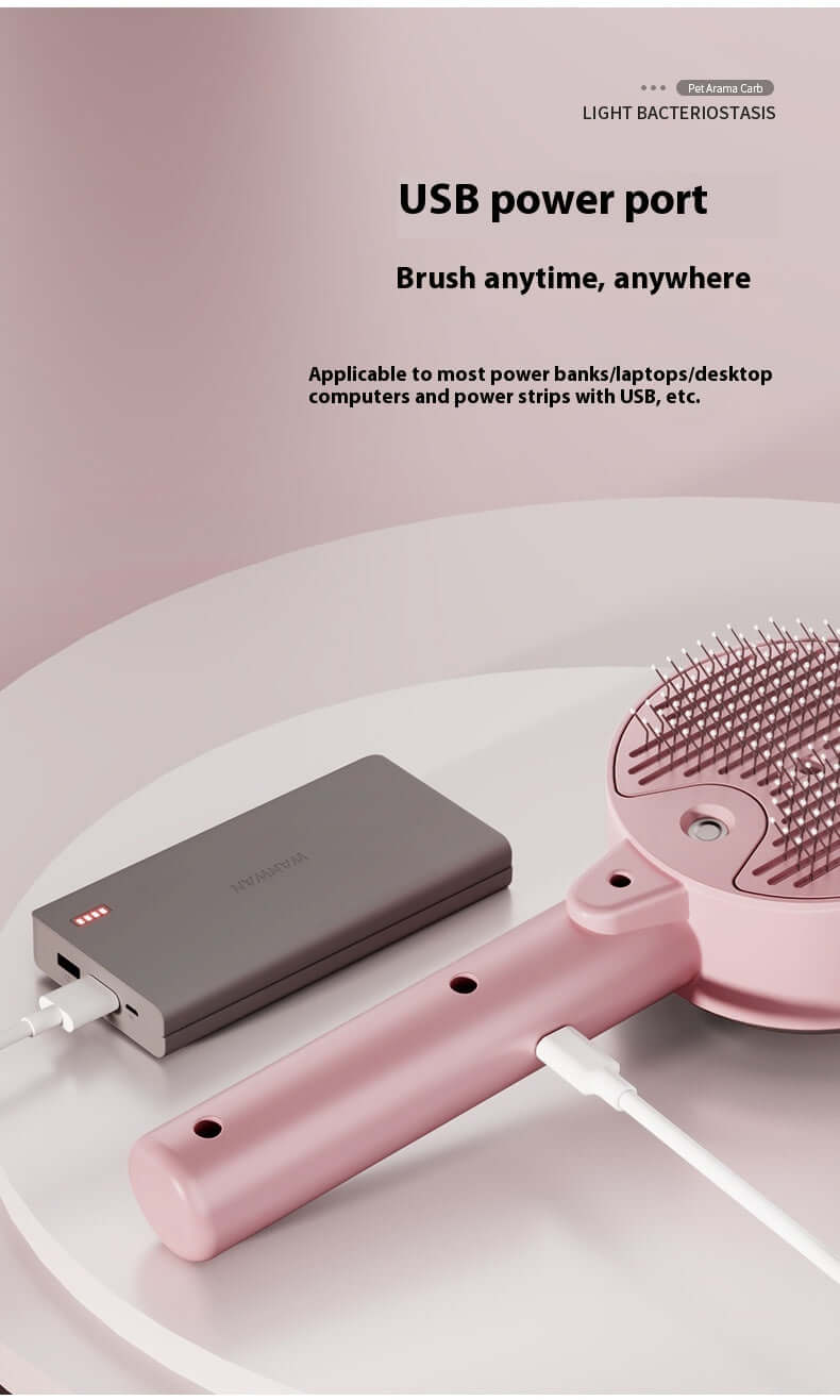 Pink dog and cat UV grooming tool connected to a power bank via USB power port