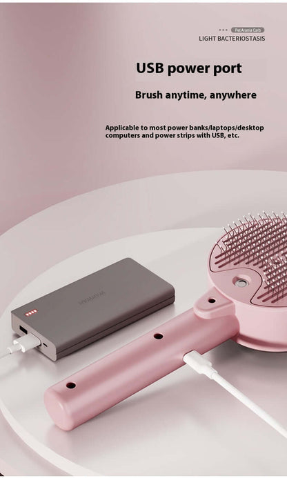 Pink dog and cat UV grooming tool connected to a power bank via USB power port