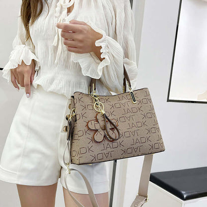Fashion printed tote bag for women in beige with dark brown handles and logo pattern
