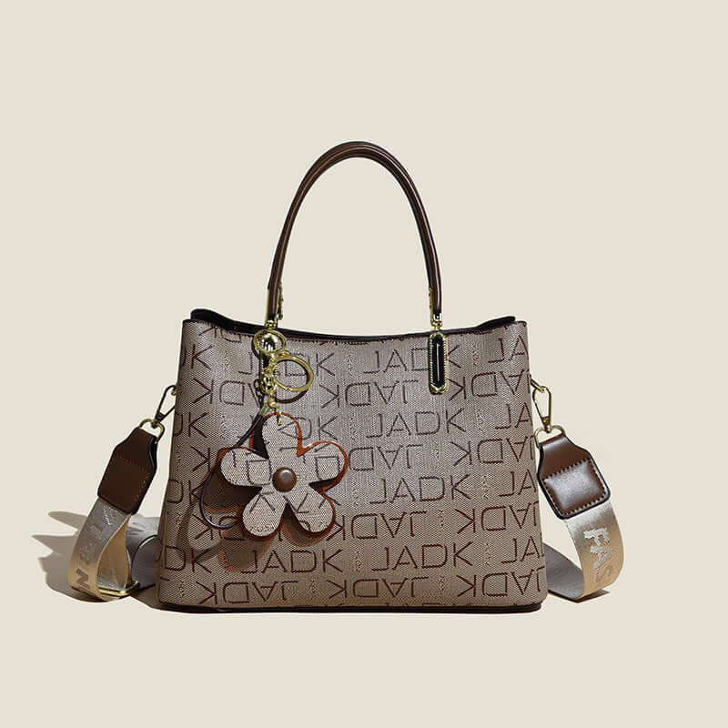 Fashion printed tote bag for women with brown handles and detachable shoulder strap featuring floral keychain