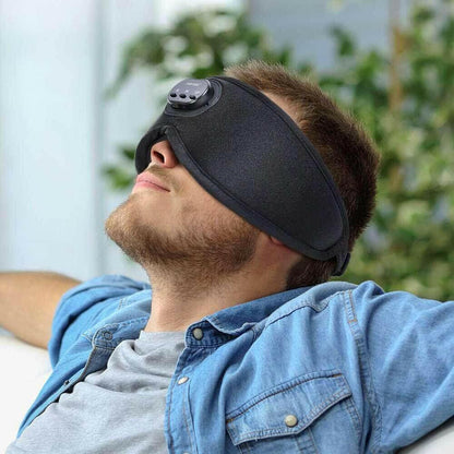 CozyTech Living full blackout smart sleep mask worn by relaxed man for improved sleep quality