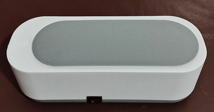 CozyTech Living ultrasonic eyeglasses cleaner in white and gray with compact sleek design