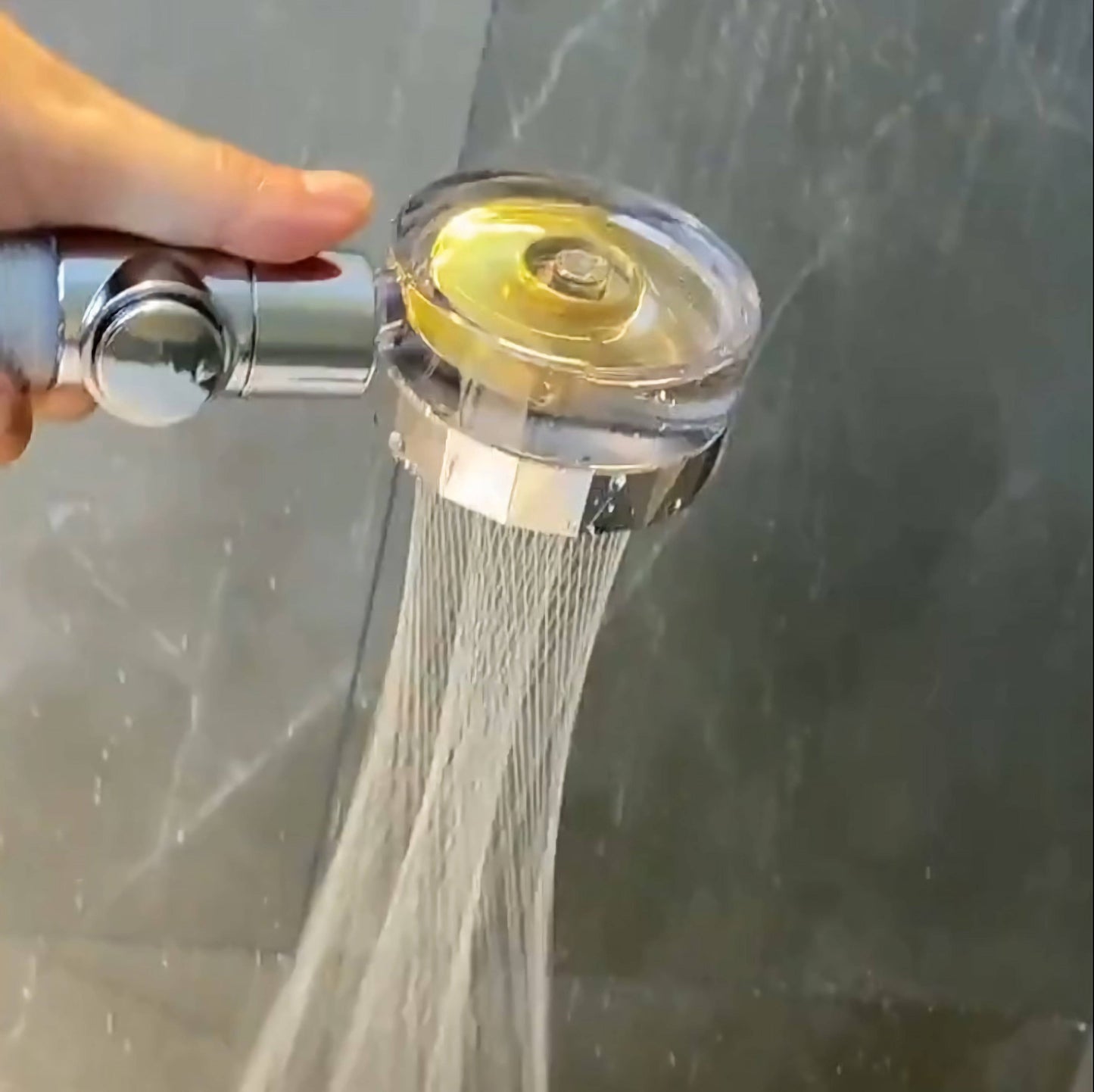 Close-up of the Vortex High Pressure Handheld Showerhead showcasing water flowing from it, illustrating the powerful shower experience.