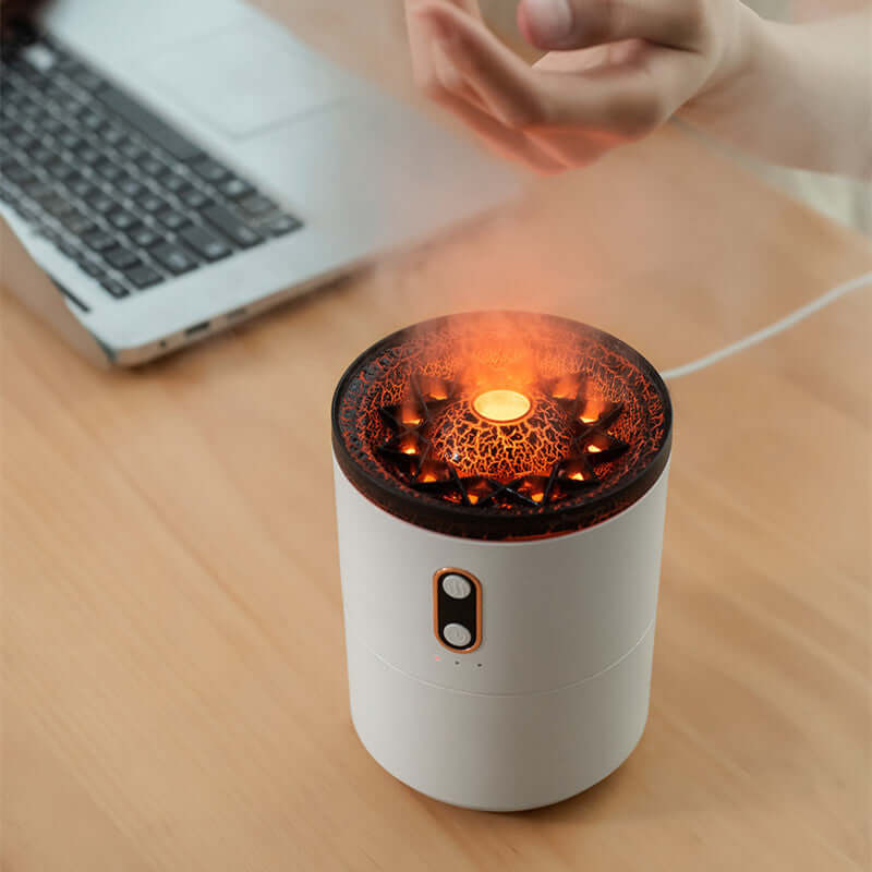 Person using Jellyfish Style Humidifier at a desk, demonstrating its portable design and soothing aroma diffusion capabilities.