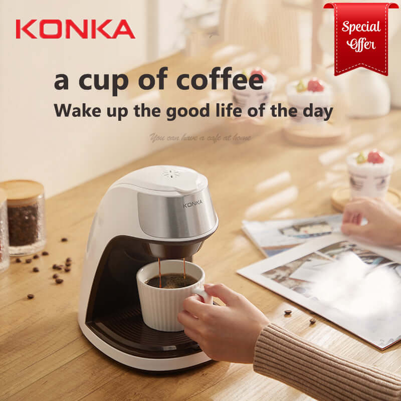 KONKA mini coffee machine for home brewing fresh coffee on wooden table with hands holding cup