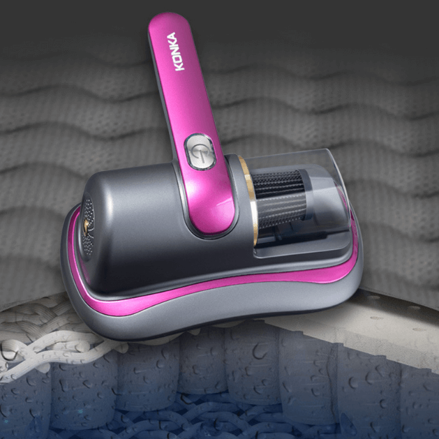 Konka smart home dust mite remover in gray and pink cleaning a mattress surface