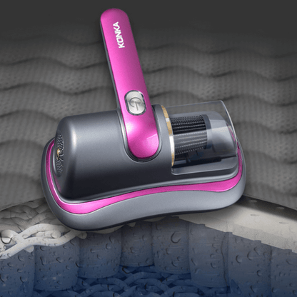 Konka smart home dust mite remover in gray and pink cleaning a mattress surface
