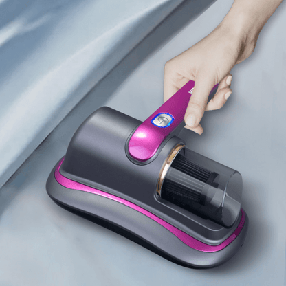 Dropshipman smart home dust mite remover in black and purple held by hand cleaning fabric surface