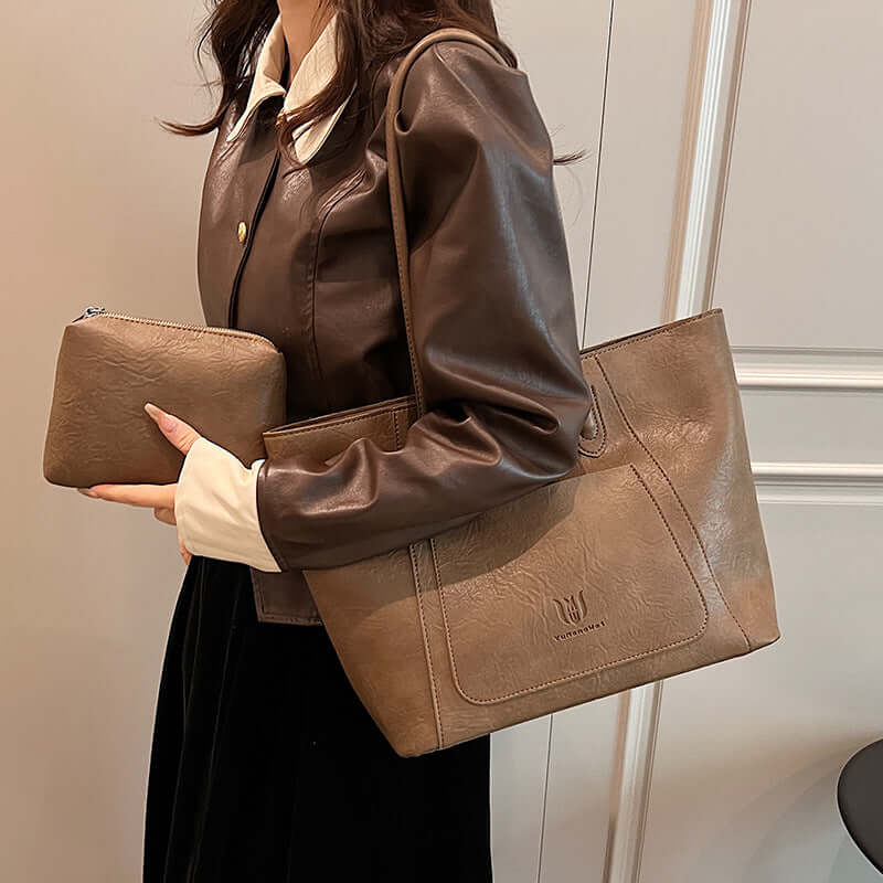 Casual Retro Shoulder Bag Texture Class Commuter Tote featuring a woman holding a medium soft tote bag in brown with an internal phone pocket.