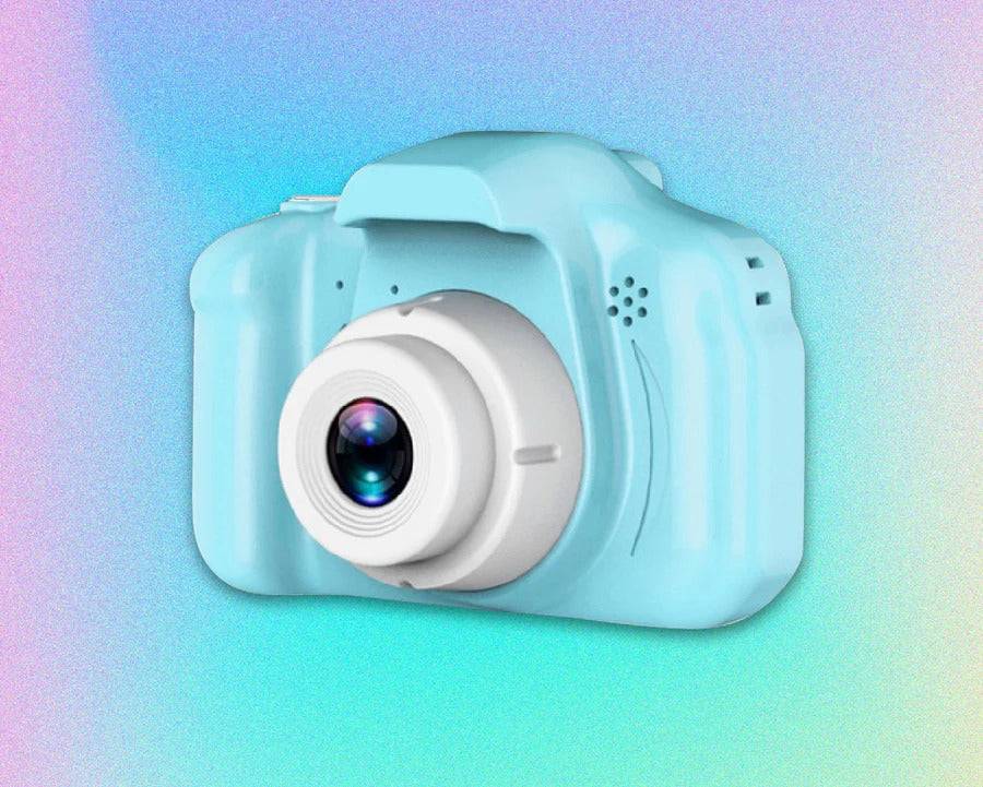 Mini Retro Camera in a light blue color with a circular lens against a colorful background, showcasing its cute design and compact size for vintage photography.