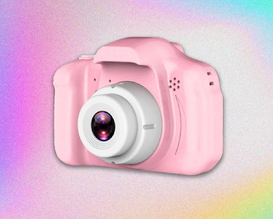 Mini Retro Camera in pink, featuring a circular lens, set against a colorful backdrop, perfect for those who love retro photography.