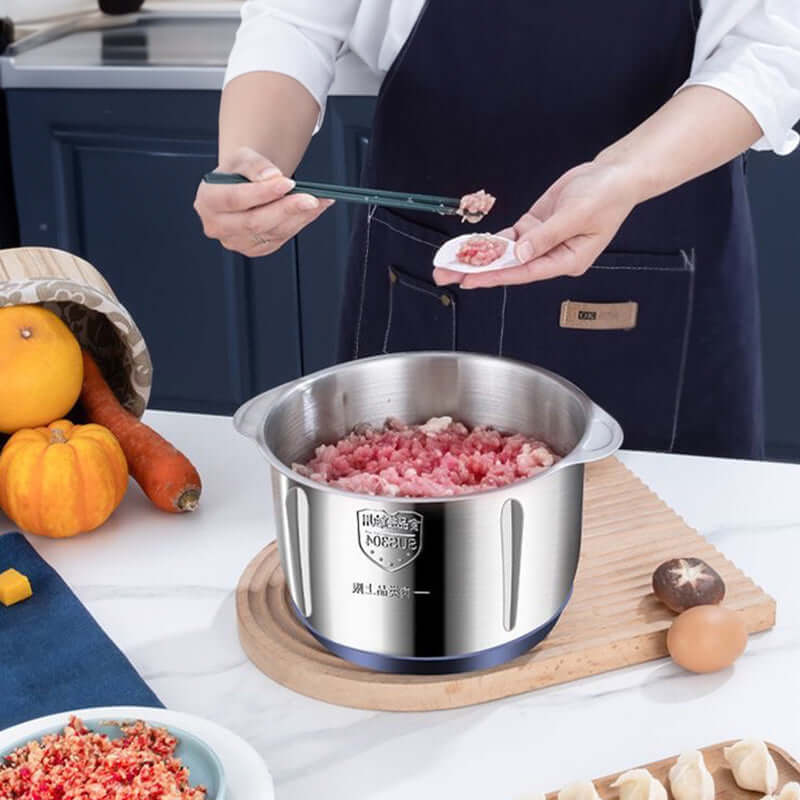Electric multifunctional food processor stainless steel bowl with ground meat for cooking preparation
