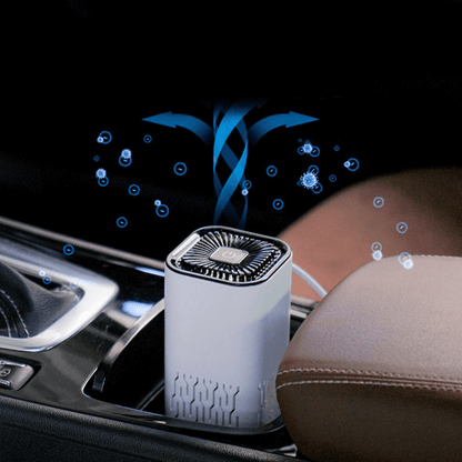 Portable car air freshener ionizer placed in car cup holder emitting fresh air particles