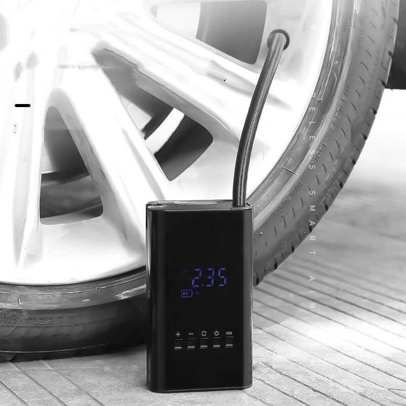 Black portable car tire inflator by Dropshipman inflating a car tire with digital display