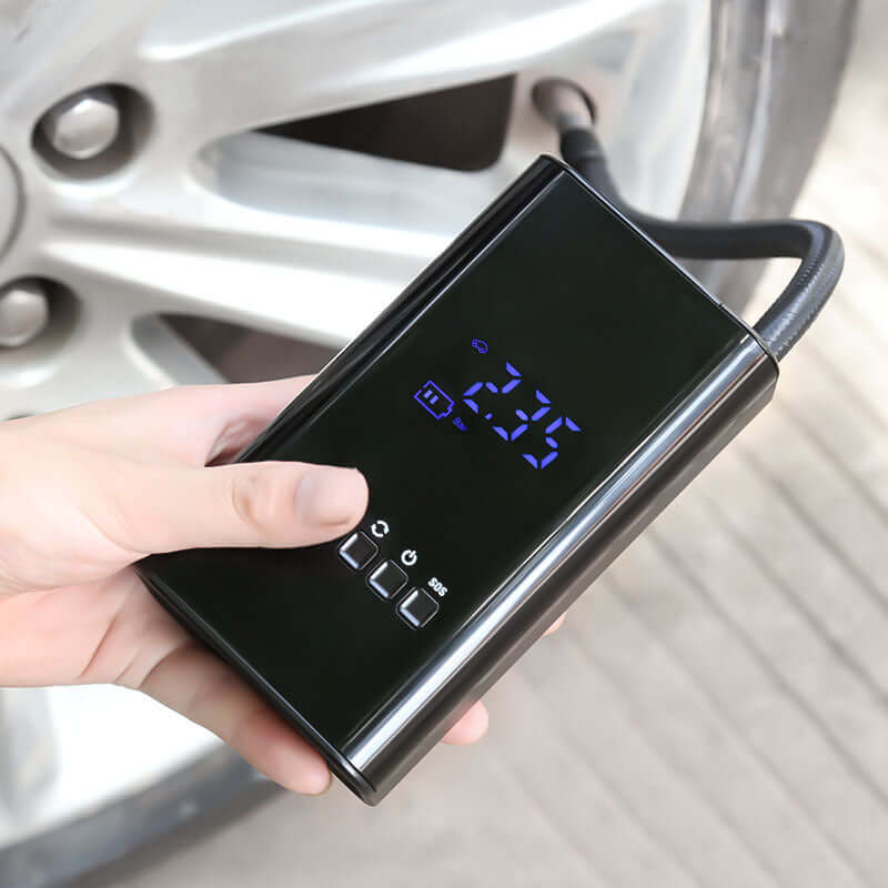 Dropshipman portable car tire inflator with digital display held near a car tire valve