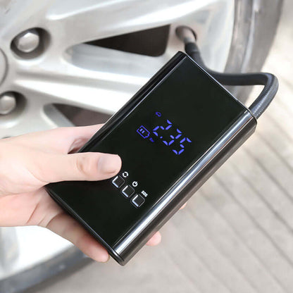 Dropshipman portable car tire inflator with digital display held near a car tire valve