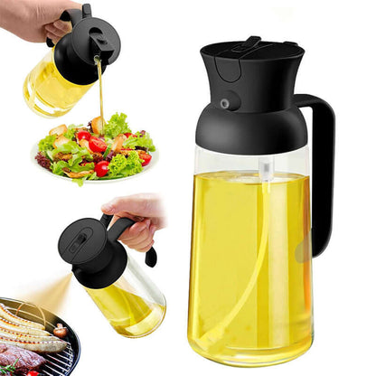 Stylish glass olive oil dispenser with black lid and handle pouring oil on salad and grill