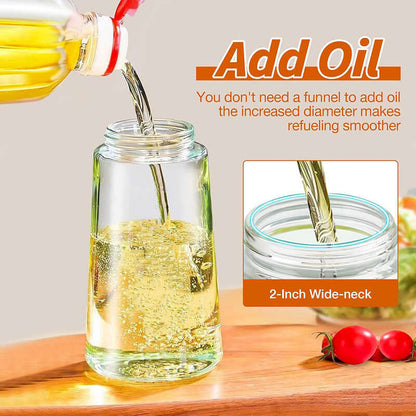 Stylish glass olive oil dispenser with a wide neck being refilled without a funnel on wooden surface