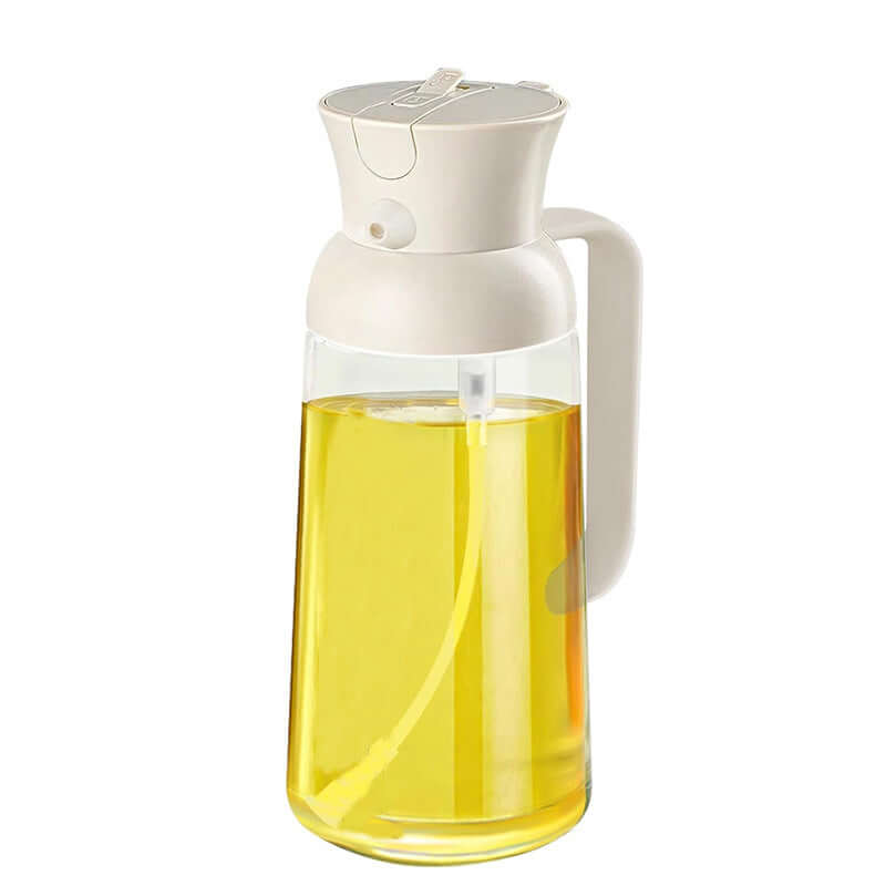 Stylish glass olive oil dispenser with white lid and handle filled with yellow olive oil